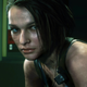 Jill Valentine sitting in a subway car.